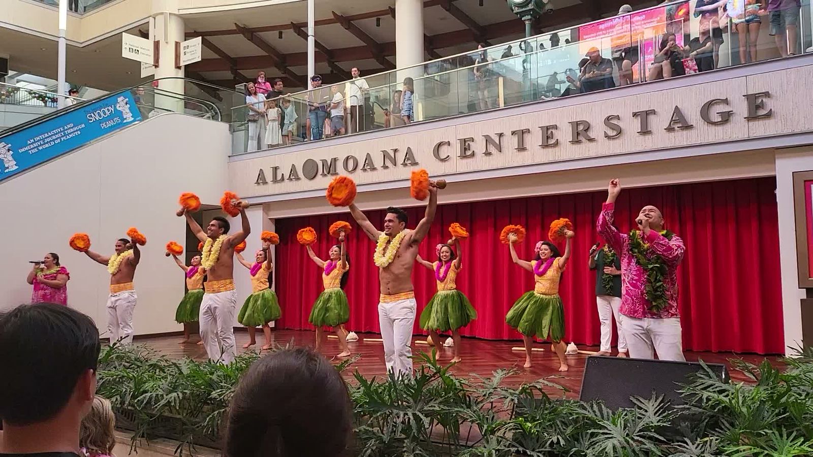 Hula dancers with 'uli'uli performing on Ala Moana Centerstage