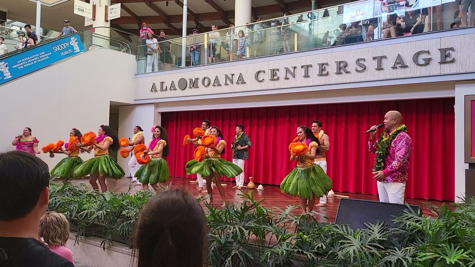 Dancers and the emcee on Ala Moana Centerstage during the free hula show