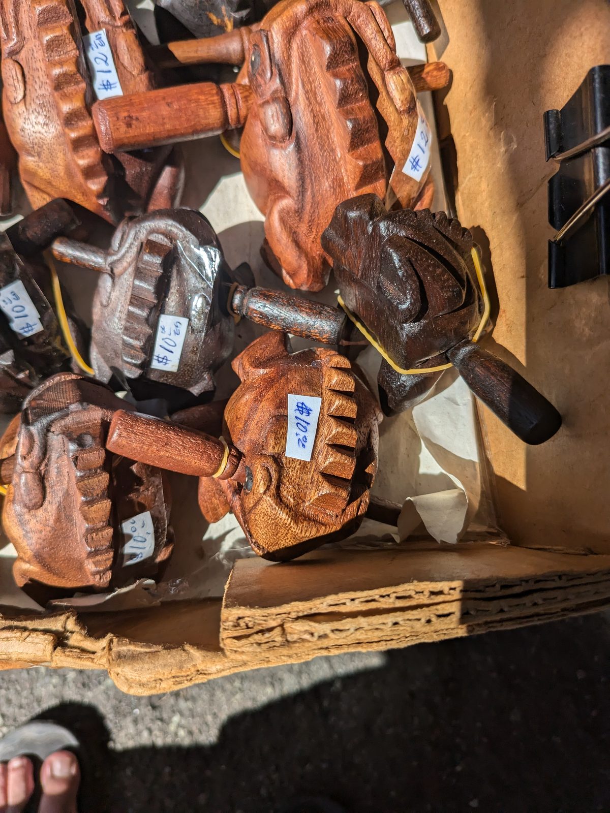 Hand-carved wooden frogs with price tags at the Aloha Stadium Swap Meet, November 2024
