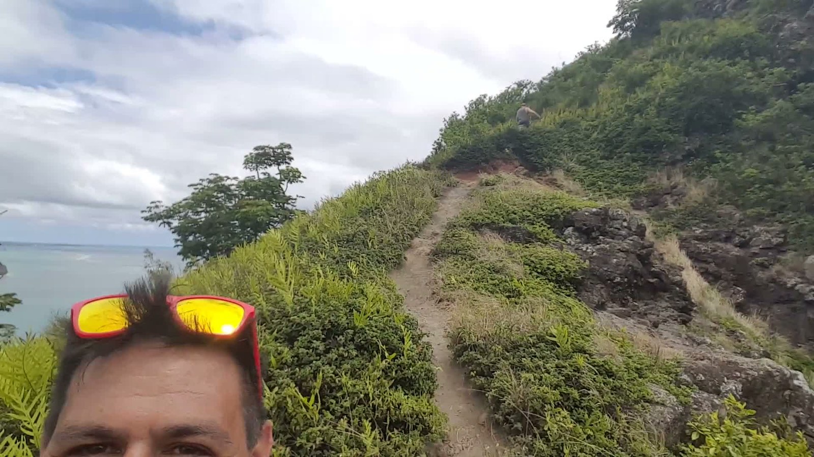 The narrow Crouching Lion trail climbing the ridge, another hiker ahead