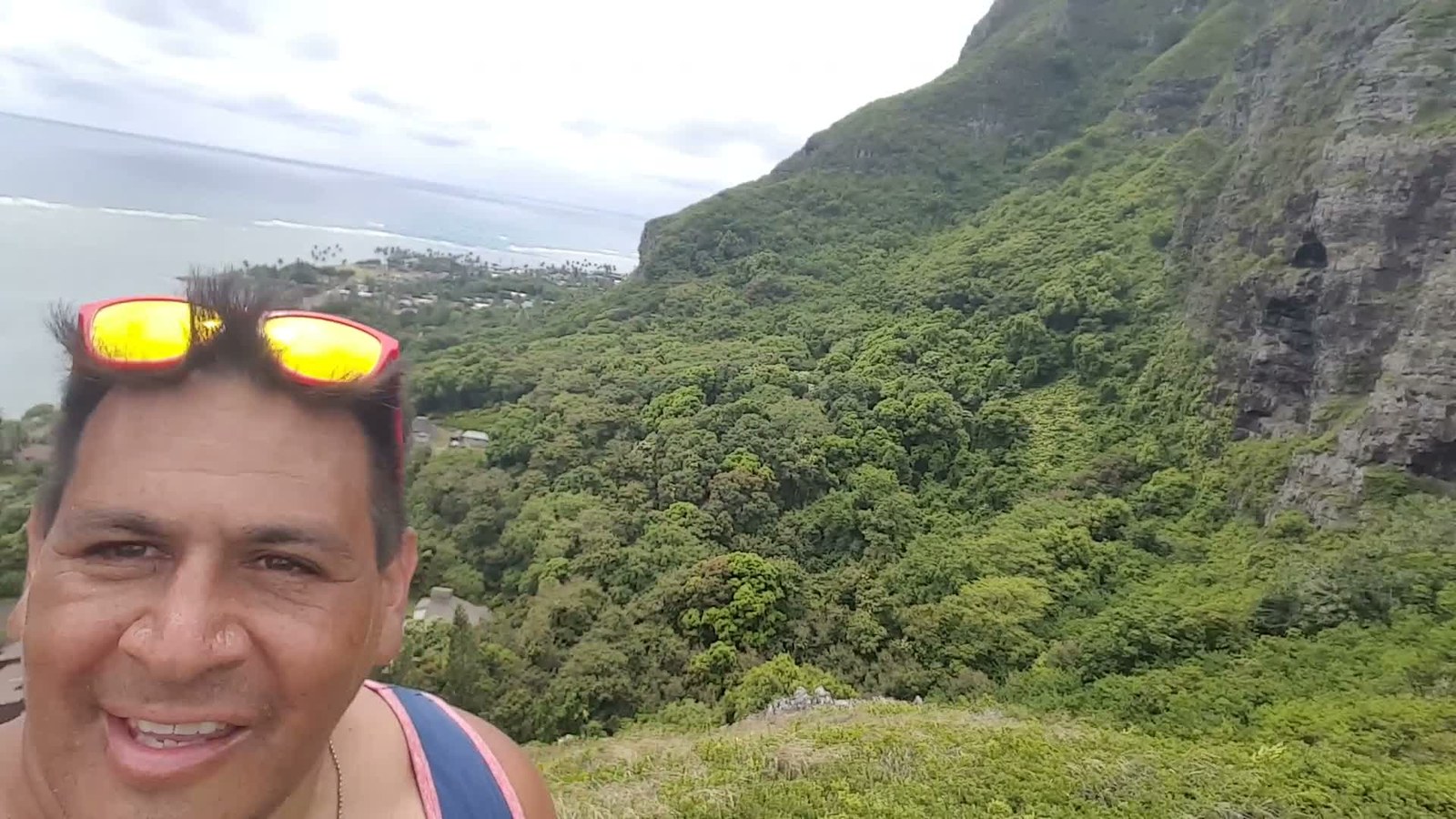 Michael on the Crouching Lion trail above the green Kaʻaʻawa valley and coast, 2017