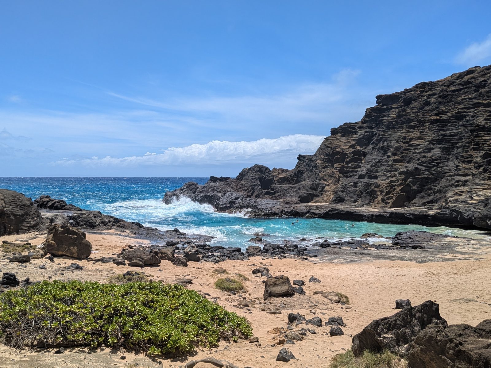 Halona Cove at beach level, waves breaking at the cove’s mouth