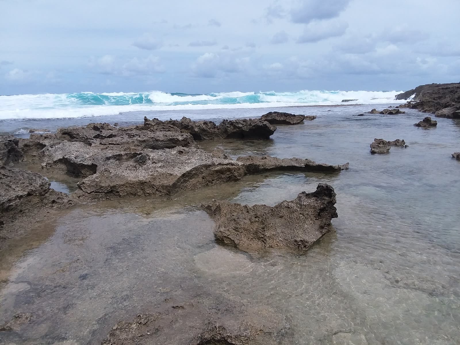 Tide pools and surf at Ka’ena Point, March 2018