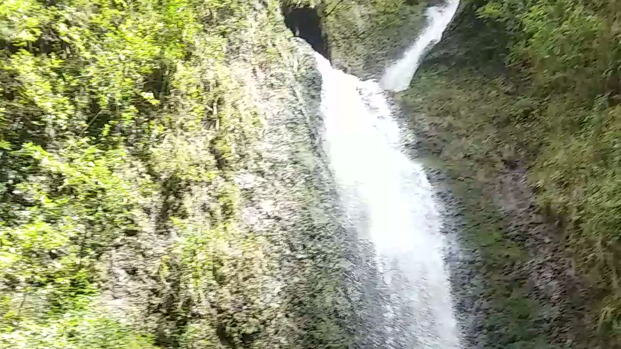 Lulumahu Falls pouring down a moss-covered rock wall, 2018